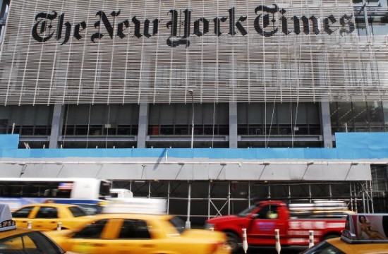 Traffic drives past The New York Times Building in New York,