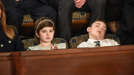 US First lady Melania Trump with Grace Eline and Joshua Trump, special guests of President Donald Trump, look during of the State of the Union address at the US Capitol on February 5, 2019 in Washington, DC