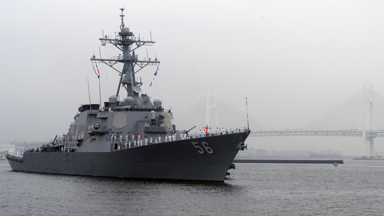 The forward-deployed guided-missile destroyer USS John S. McCain, DDG 56, approaches Osanbashi Pier in the Port of Yokohama, Japan, 2009.