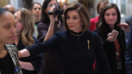 Speaker of the House Nancy Pelosi walks to the House floor at the US Capitol, while the House readies for a historic vote on December 18, 2019 in Washington, DC.