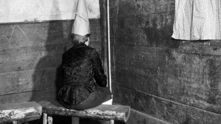 child wearing dunce cap