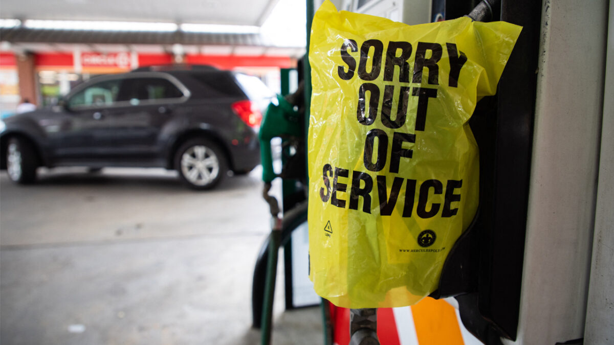 An Out Of Service bag covers a gas pump as cars continue line up for the chance to fill their gas tanks at a Circle K near uptown Charlotte, North Carolina on May 11, 2021 following a ransomware attack that shut down the Colonial Pipeline.