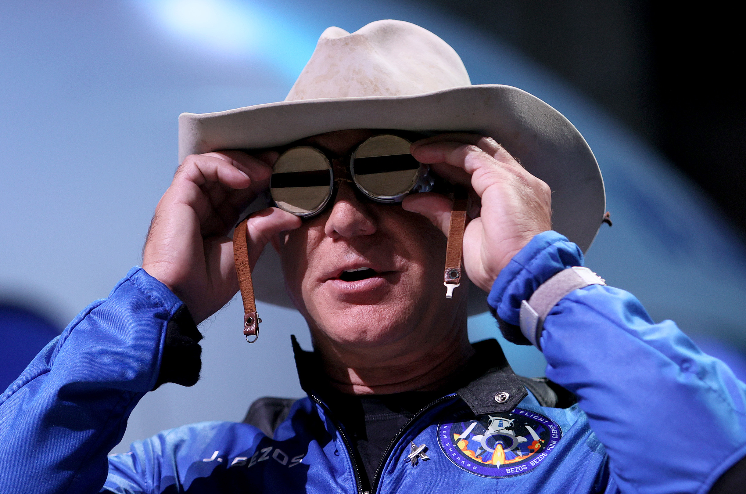 Jeff Bezos wearing cowboy hat and goggles