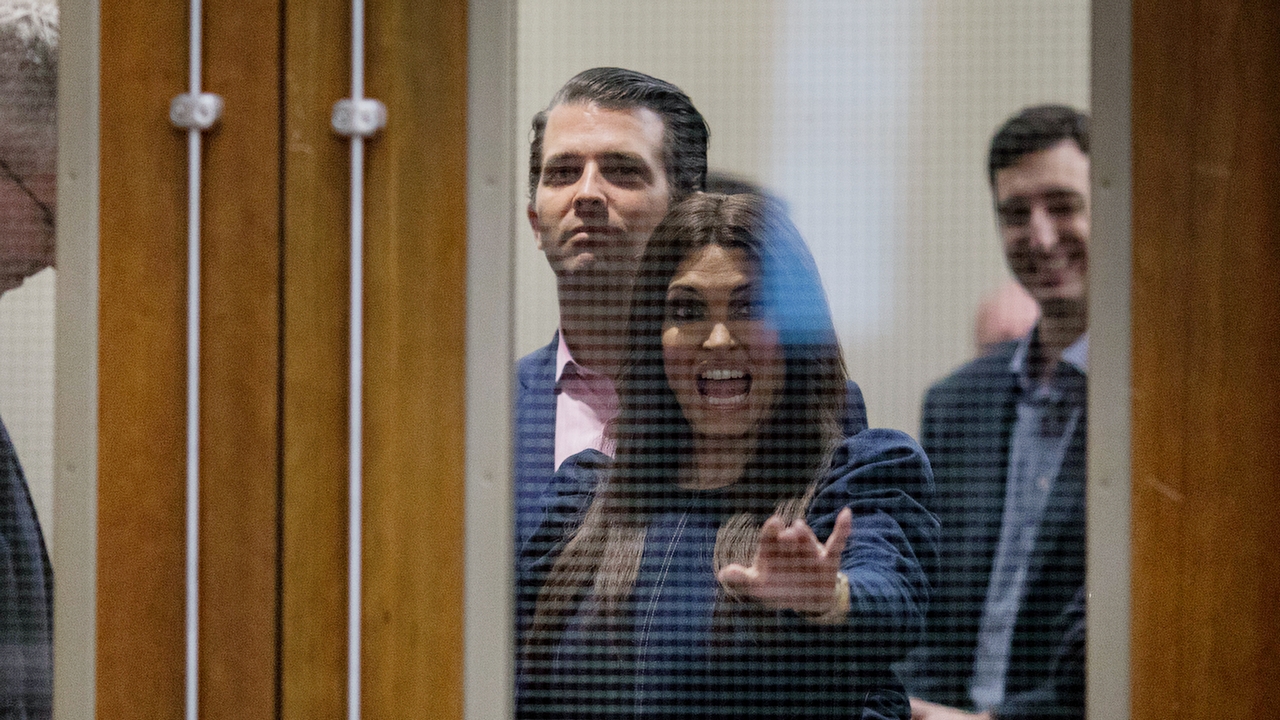 CONROE, TX - OCTOBER 03: Donald Trump Jr. and Kimberly Guilfoyle wait in a hallway before taking the stage to speak at a campaign rally for U.S. Sen. Ted Cruz (R-TX) on October 3, 2018 in Conroe, Texas. Cruz is in a tight reelection race against Democratic opponent Beto O'Rourke. (Photo by Loren Elliott/Getty Images)