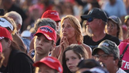 WELLINGTON, OHIO - JUNE 26: Supporters listen as Former US President Donald Trump speaks during a rally at the Lorain County Fairgrounds on June 26, 2021 in Wellington, Ohio. Trump is in Ohio to campaign for his former White House advisor Max Miller. Miller is challenging incumbent Rep. Anthony Gonzales in the 16th congressional district GOP primary. This is Trump's first rally since leaving office. (Photo by Scott Olson/Getty Images)