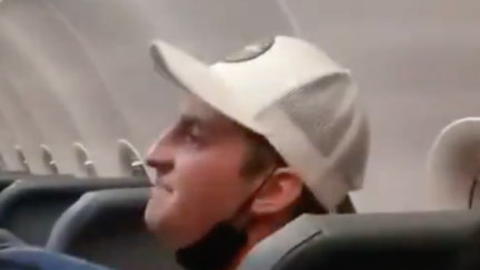 Screaming, violent Frontier passenger