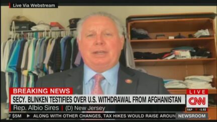 Rep. Albio Sires Zooms into hearing from what looks like his closet