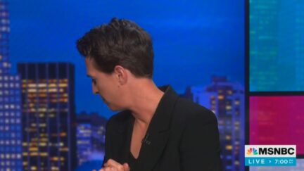 Rachel Maddow deals with a tech issue on set