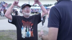 Jordan Klepper speaking to a Trump supporter at Trump rally