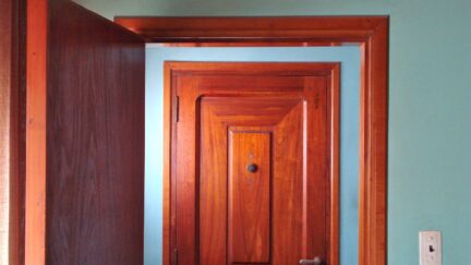 wood door doorway doorknob knob