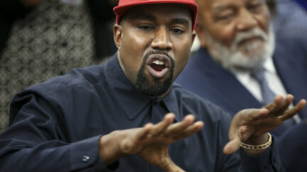 Kanye West wearing MAGA hat