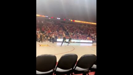College basketball coach makes team run sprints during the game