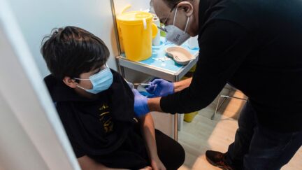 Medics administer the first dose of a Covid-19 vaccine in the Cypriot capital Nicosia, on January 2, 2022, as the country begins vaccinations for children between the ages of five and eleven, amid a sharp surge in coronavirus cases.