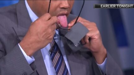 Charles Barkley uses his tongue to clean his glasses