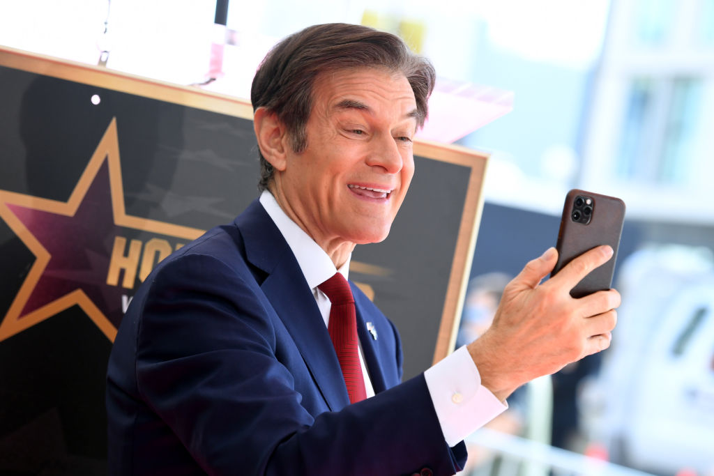 Dr. Mehmet Oz takes a selfie at the Hollywood Walk of Fame