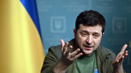 Ukrainian President Volodymyr Zelensky press conference with flag in background