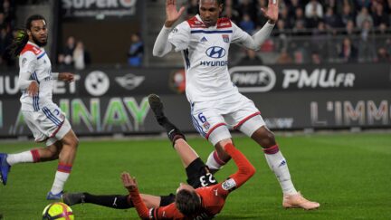 Rennes' French midfielder Adrien Hunou (L) vies with Lyon's Brazilian defender Marcelo during the French L1 football match Stade Rennais vs Olympique Lyonnais (OL), on March 29, 2019 at the Roazhon Park stadium in Rennes, western France.