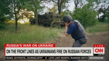 Matthew Chance near Ukrainian tank