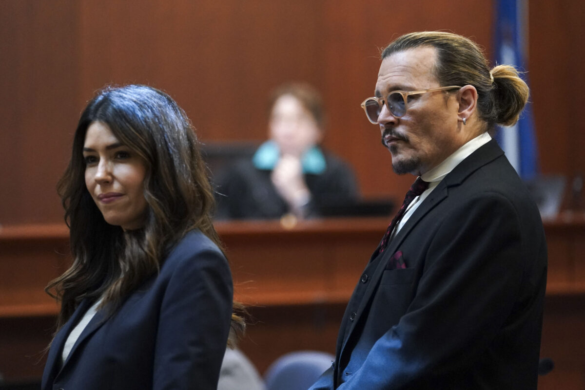 US actor Johnny Depp stands next to his lawyer Camille Vasquez