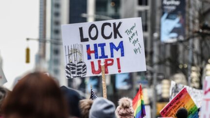 NEW YORK, NY - JANUARY 19: A person holds a sign that reads 