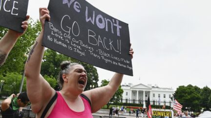 An abortion rights activist shouts during a demonstration in front of the White House in Washington, DC on July 09, 2022. - The US Supreme Court overturned the landmark 1973 Roe v. Wade ruling that recognized women's constitutional right to abortion, sparking protest nationwide. (Photo by ROBERTO SCHMIDT / AFP) (Photo by ROBERTO SCHMIDT/AFP via Getty Images)