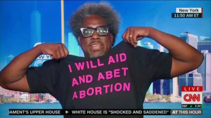 'I Will Aid and Abet Abortions' W. Kamau Bell showws off t-shirt