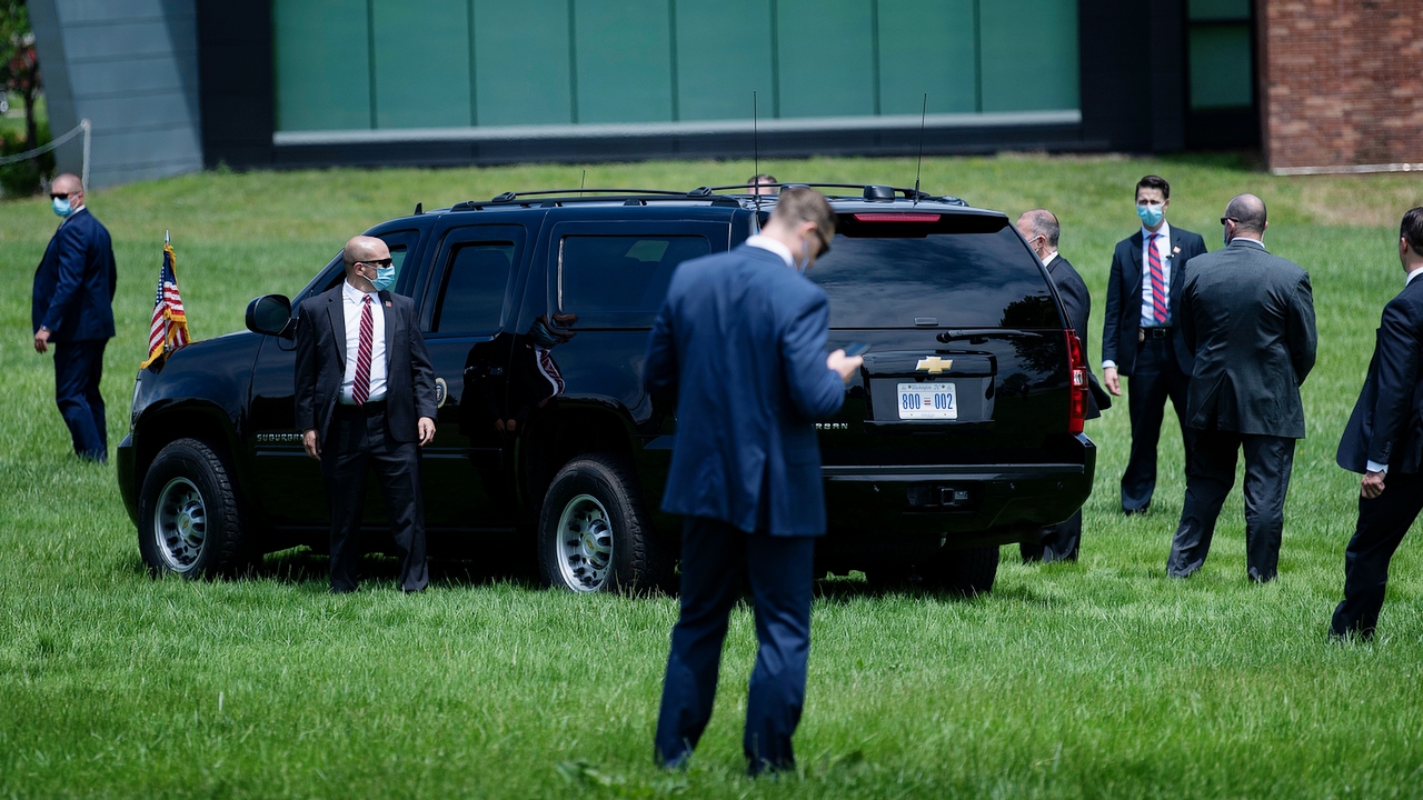 Members of the Secret Service guard the US president's limo as he leaves a Memorial Day event at the Fort McHenry National Monument May 25, 2020, in Baltimore, Maryland.