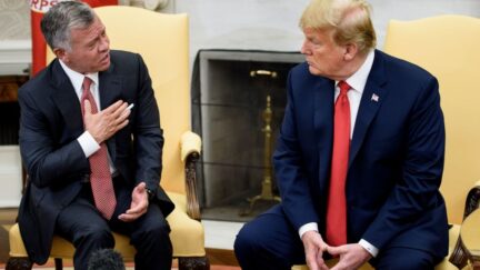 Jordan's King Abdullah II (L) speaks to US President Trump