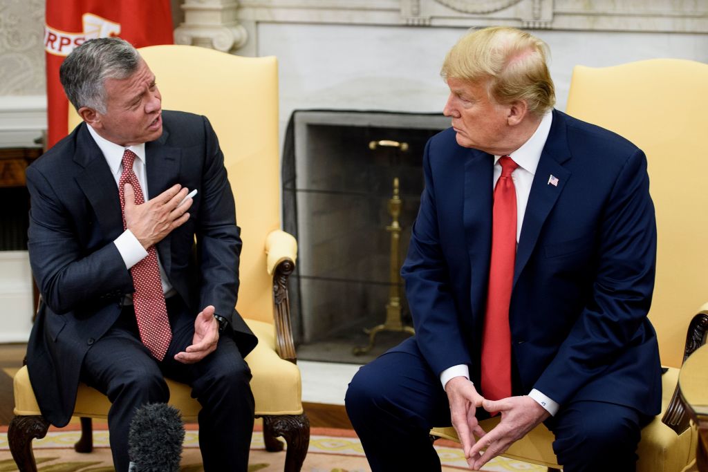 Jordan's King Abdullah II (L) speaks to US President Trump