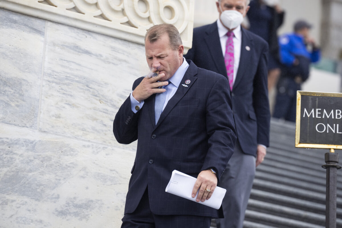 GOP Congressman smoking a cigar