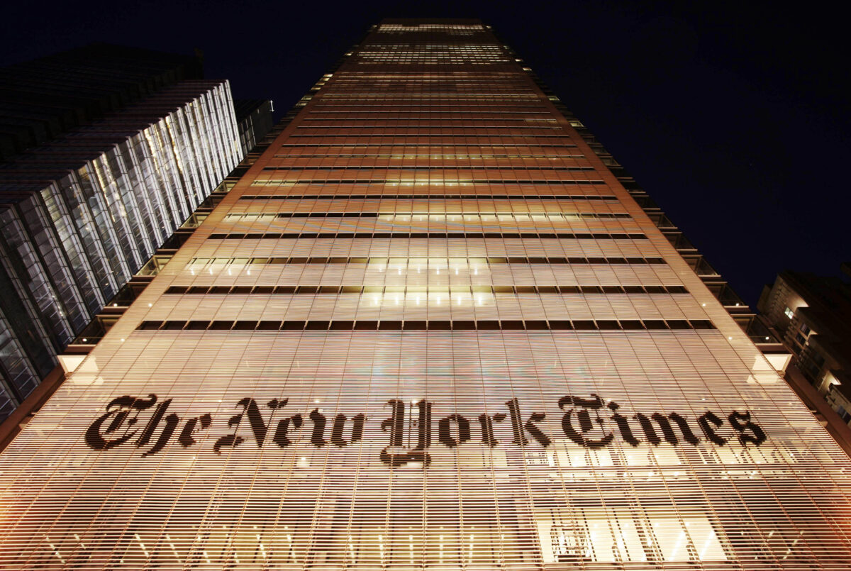 The New York Times building shown at night in NYC
