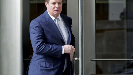 FILE - In this Feb. 14, 2018 file photo, Paul Manafort, President Donald Trump's former campaign chairman, leaves the federal courthouse in Washington. Manafort has been released from federal prison to serve the rest of his sentence in home confinement over concerns about the coronavirus, his lawyer said Wednesday. (AP Photo/Pablo Martinez Monsivais, File)