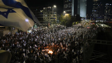 Israelis opposed to Prime Minister Benjamin Netanyahu's judicial overhaul plan set up bonfires and block a highway during a protest moments after the Israeli leader fired his defense minister, in Tel Aviv, Israel, Sunday, March 26, 2023. Defense Minister Yoav Gallant had called on Netanyahu to freeze the plan, citing deep divisions in the country and turmoil in the military.
