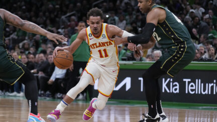 Trae Young being guarded by Al Horford
