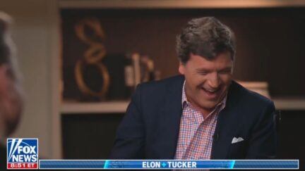 Tucker Carlson laughing