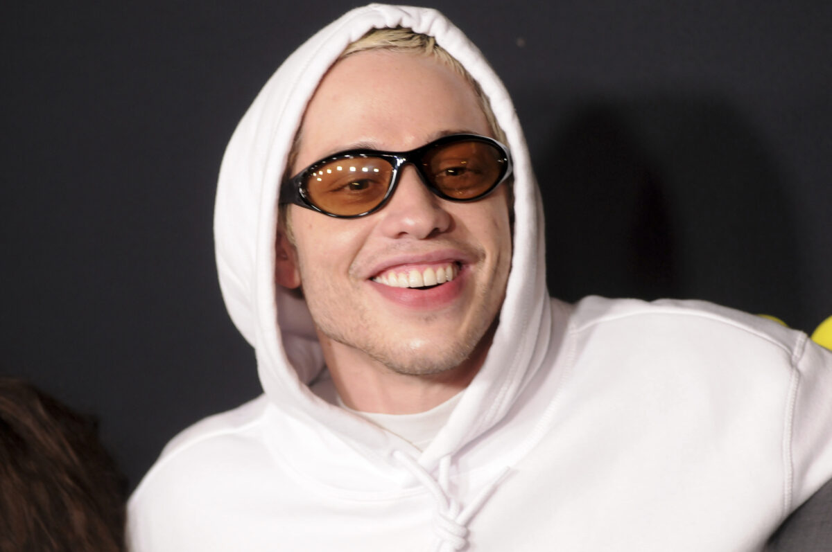 Pete Davidson wearing a hoodie and sunglasses