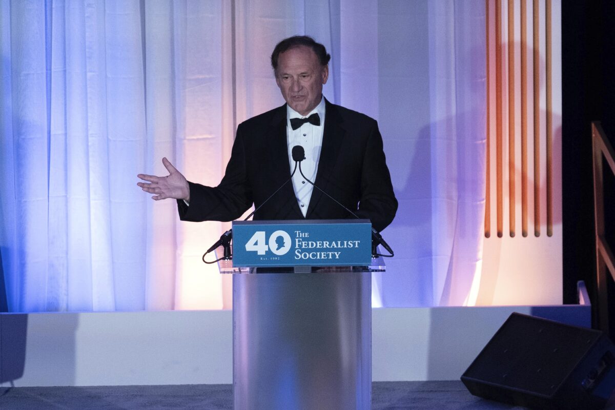 Justice Samuel Alito speaks in front of the Federalist Society