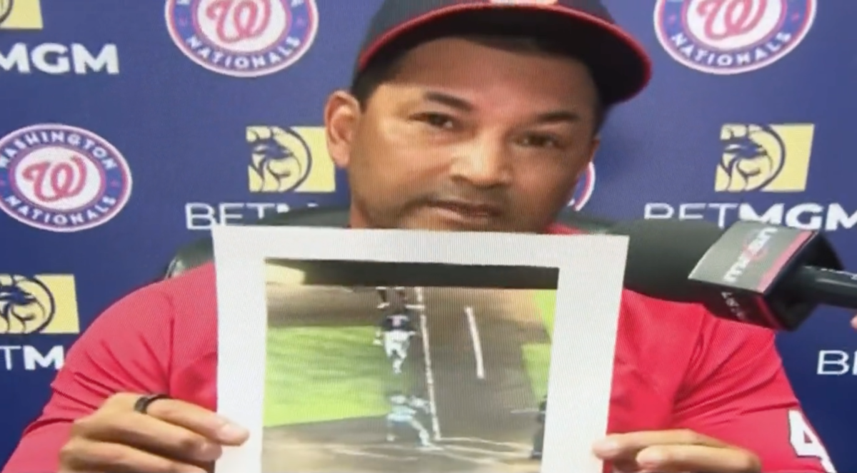 Washington Nationals manager Dave Martinez answered the phone when