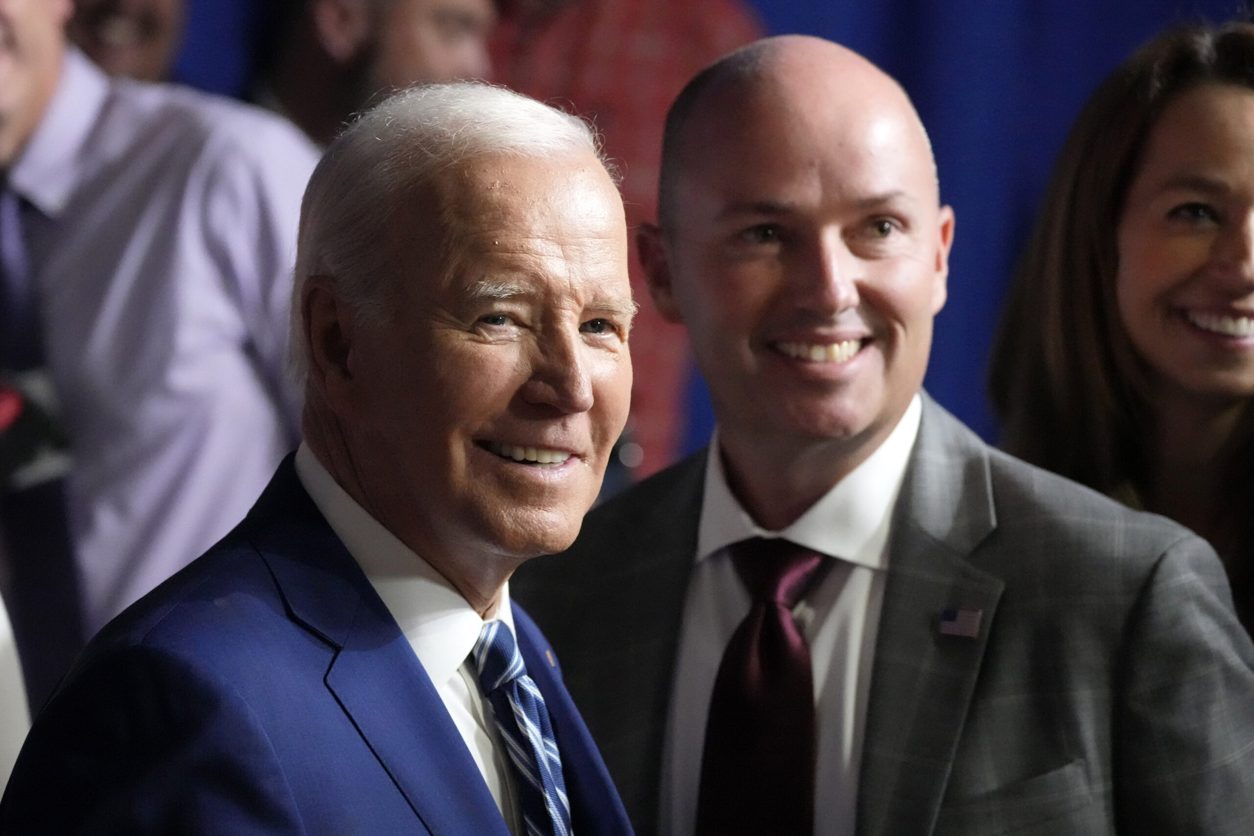 President Joe Biden smiles as he stands with Utah Gov. Spencer Cox after speaking at the George E. Wahlen Department of Veterans Affairs Medical Center, Thursday, Aug. 10, 2023, in Salt Lake City.