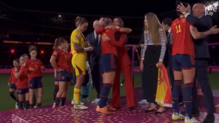 Royal Spanish Football Federation President Luis Rubiales kisses player Jenni Hermoso