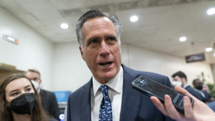 FILE - Sen. Mitt Romney, R-Utah, talks to reporters during votes, at the Capitol in Washington, Tuesday, Feb. 15, 2022. Romney will not run for reelection in 2024. The former presidential candidate and Massachusetts governor announced his intentions in a video statement Wednesday.