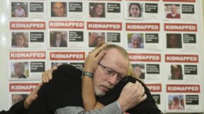Orit Meir, right, mother of Israel hostage Almog Meir is comforted by Thomas Hand, left, father of 9 year old Irish-Israeli hostage Emily Hand, both taken after the Oct. 7 assault by Hamas militants, attend a news conference at the Israel Embassy in London, Monday, Nov. 20, 2023. More than 200 Israelis and foreigners were taken hostage on Oct. 7 after Hamas militants infiltrated Israel.