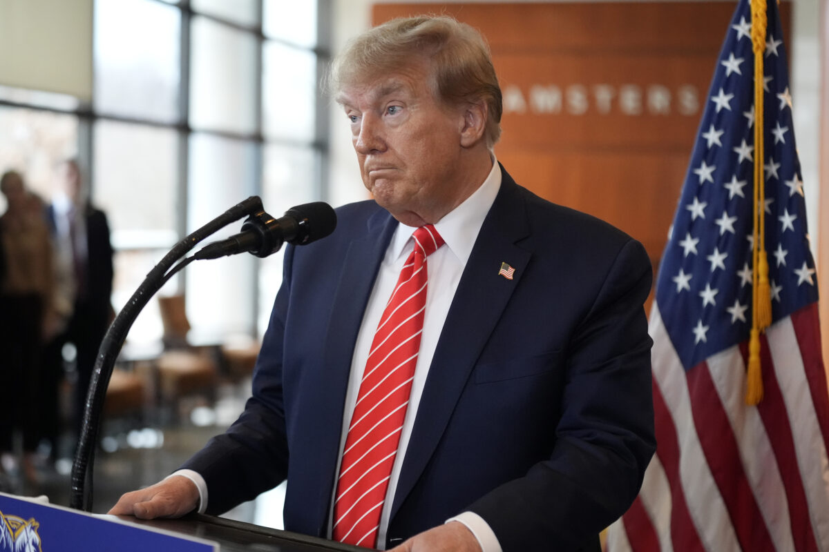 donald trump standing at microphone