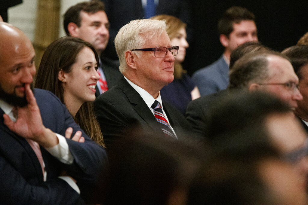 Jim Hoft, publisher of the Gateway Pundit, listens as President Donald Trump speaks during the "Presidential Social Media Summit" in the East Room of the White House, Thursday, July 11, 2019, in Washington. 
