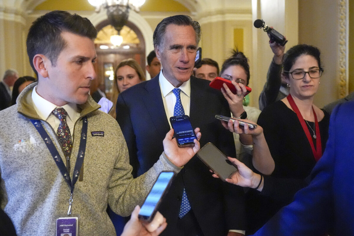 Sen. Mitt Romney, R-Utah, speaks with members of the media as he walks Wednesday, Feb. 28, 2024, at the Capitol in Washington. Earlier Sen. Mitch McConnell announced that he'll step down as Senate Republican leader in November.