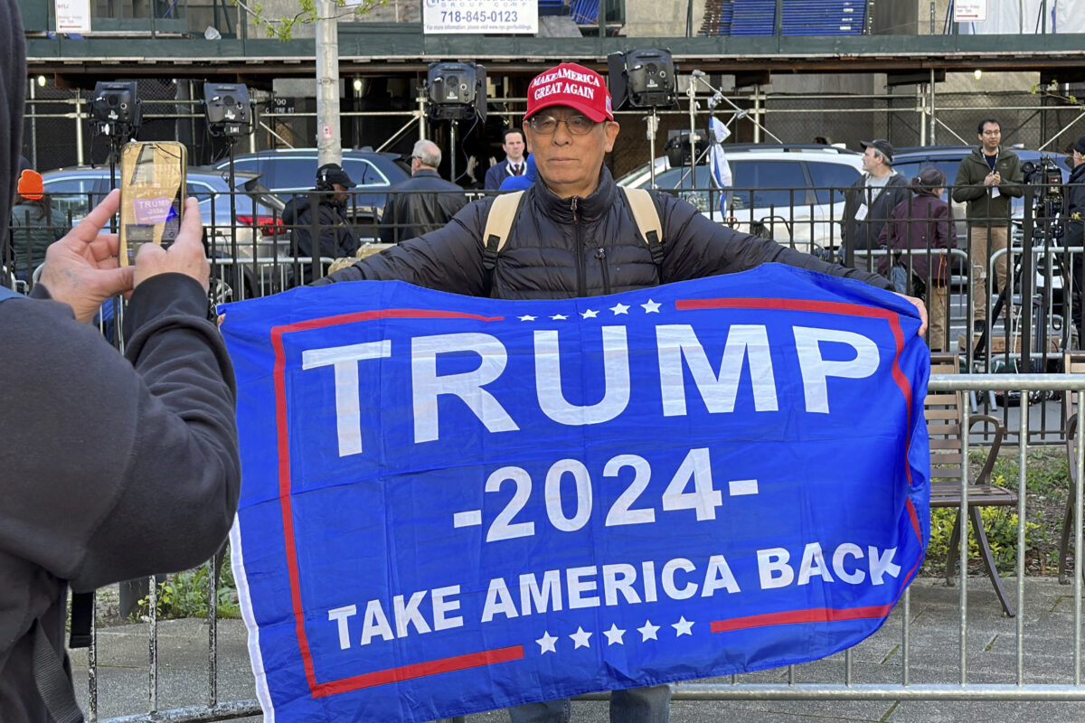 A supporter of former president Donald Trump is in Collect Pond Park on Monday, April 22, 2024, outside the New York City courthouse where former president Donald Trump's hush money criminal trial is underway.