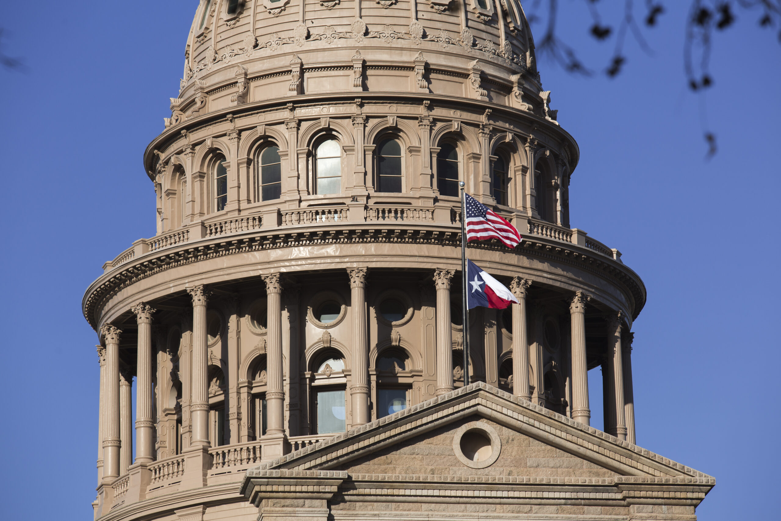 Capitol Building in Austin, Texas, showing American and Texan flags