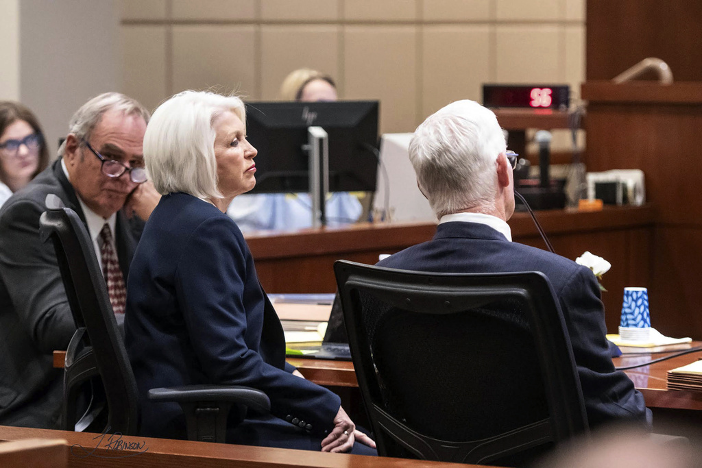 Former Mesa County Clerk and Recorder Tina Peters, middle, listens to the prosecution during her sentencing for her election interference case at the Mesa County District Court Thursday, Oct. 3, 2024, in Grand Junction, Colo.