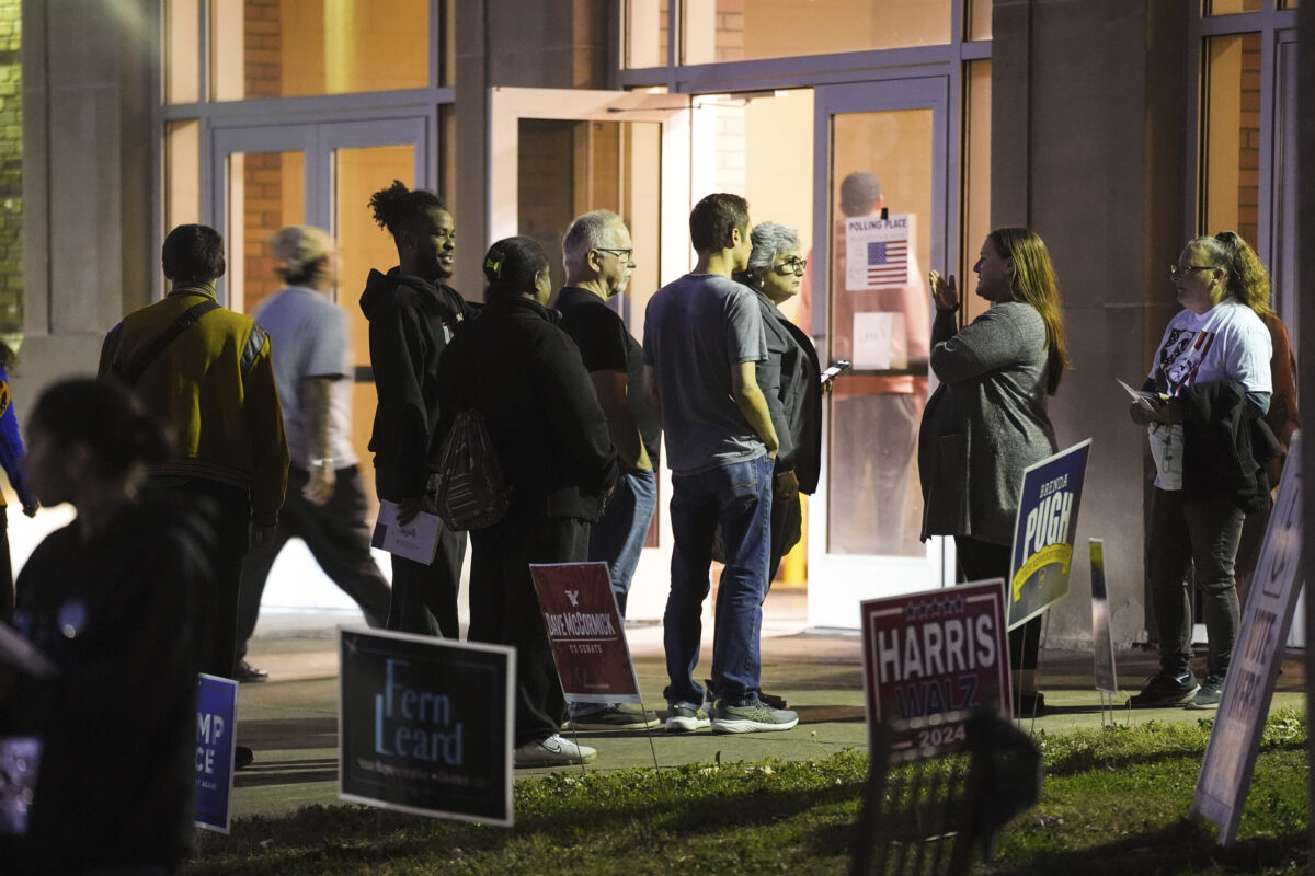 Voters wait in line to cast their ballots at the Kingston Armory in Wilkes-Barre, Pa, Tuesday, Nov. 5, 2024.