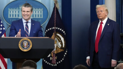 President Donald Trump listens as Defense Secretary Pete Hegseth speaks in the James Brady Press Briefing Room at the White House, Thursday, Jan. 30, 2025, in Washington.